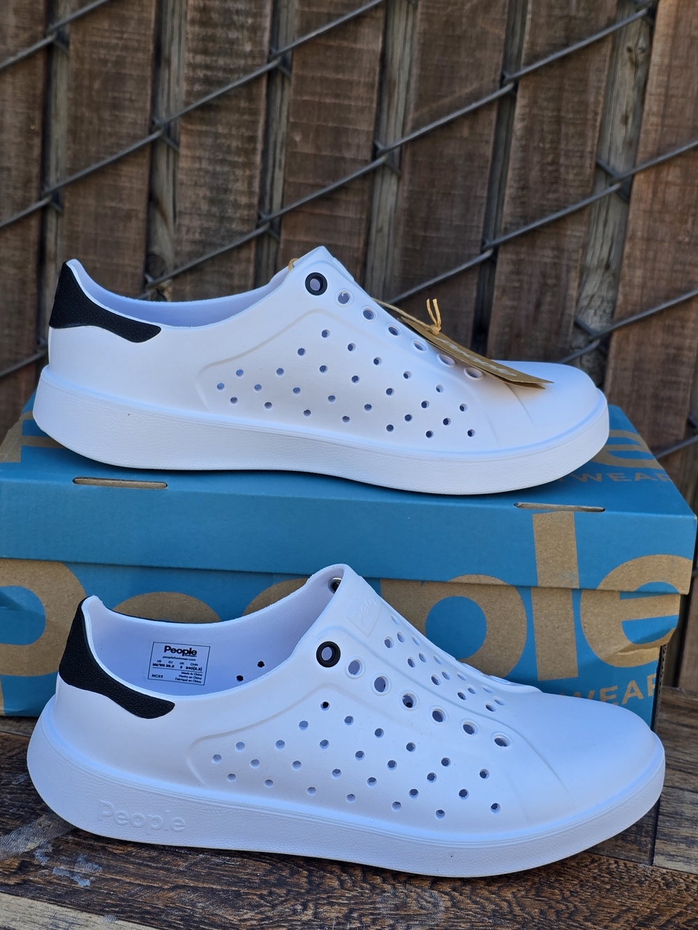 Footwear White Slip On Perforated Sneakers with Black Heel Accent Size 6